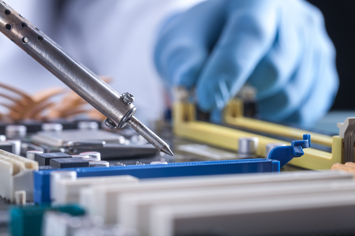 The scientist holds the computer part